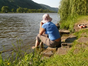 sitting on riverbank